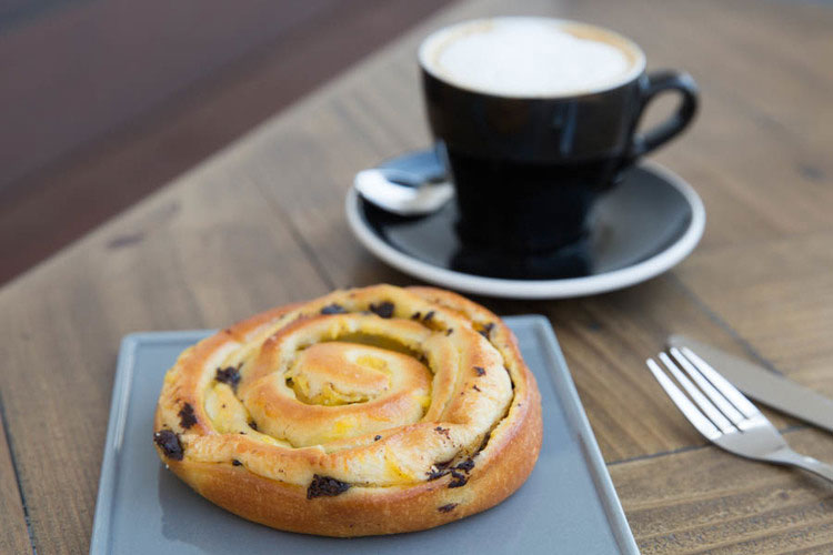 Espresso coffee with a swirly pastry